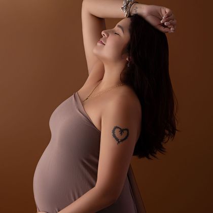 Maternity portrait in a mauve gown